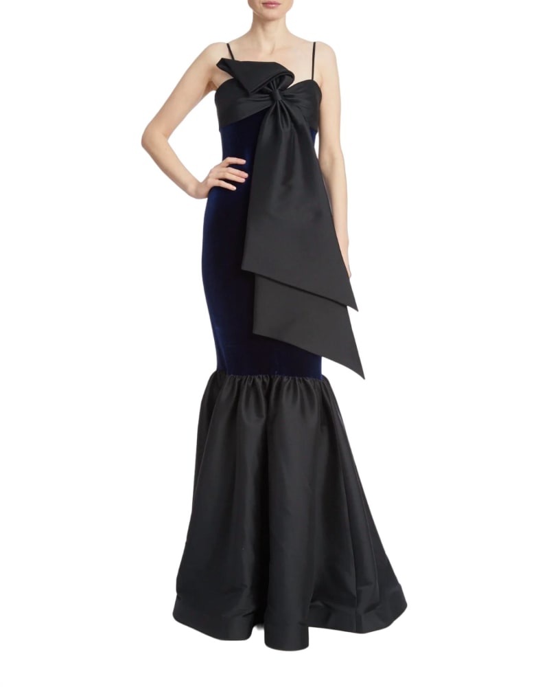 Front of a model wearing a size 14 Two-Tone Velvet Bow Mermaid Gown In Midnight Black in Midnight Black by Badgley Mischka. | dia_product_style_image_id:346682